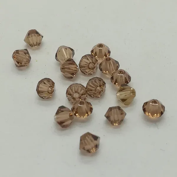 Swarovski - Cristalli bi-cono 4 mm - Light Smoked Topaz (10 pz)